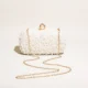 White beaded box clutch with extended gold-tone chain