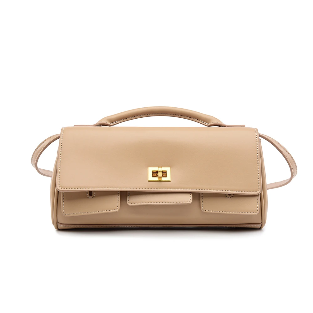 Beige structured flap clutch with top handle and side strap attachments