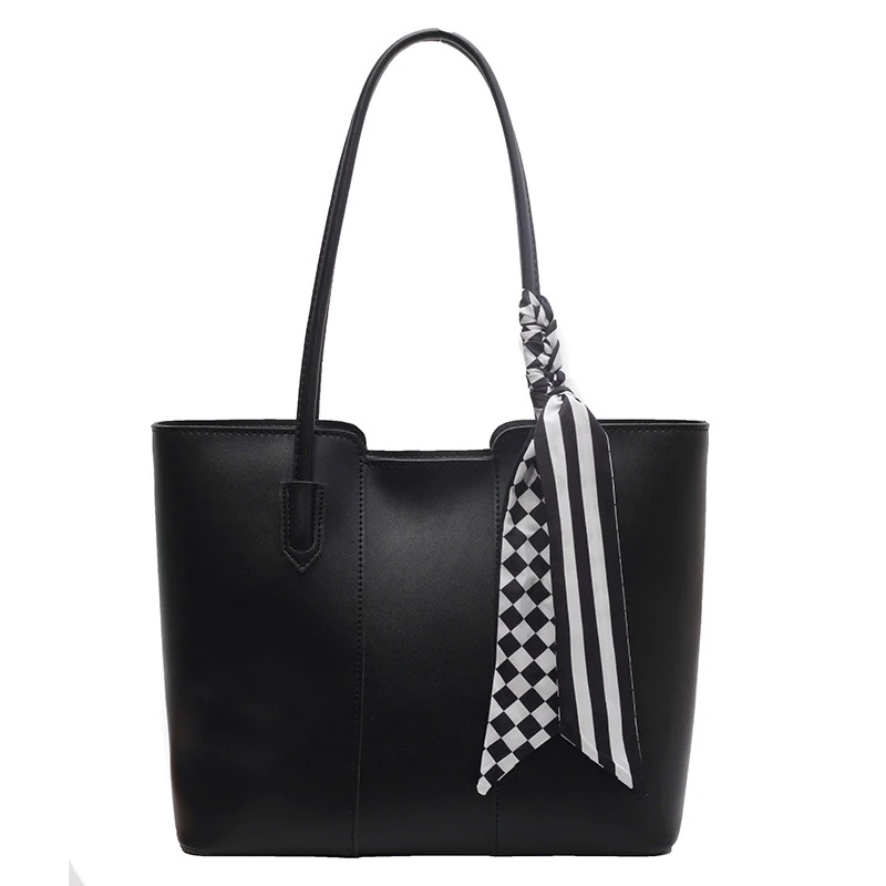 Black open-top tote with black and white patterned scarf