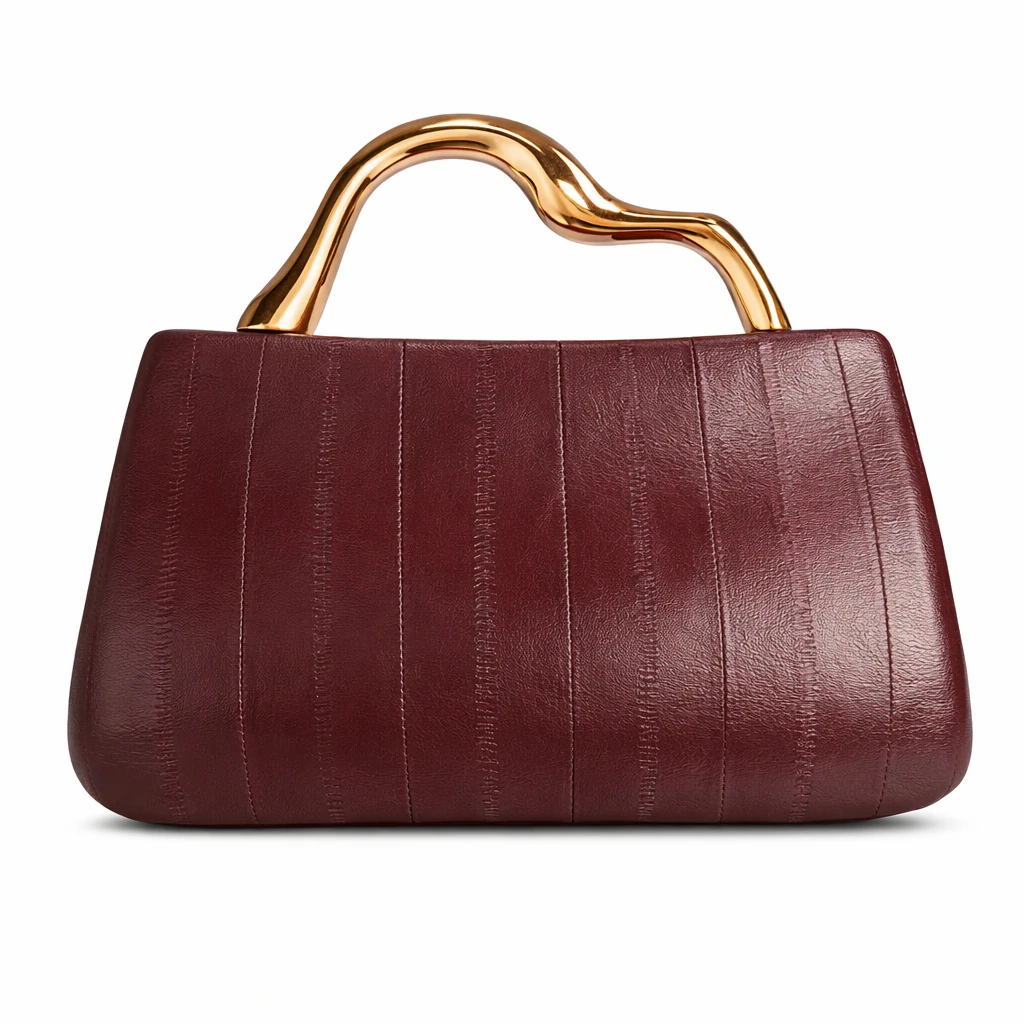 Burgundy evening clutch with vertical seams and sculpted handle