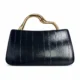 Navy evening clutch with sculpted gold-tone handle