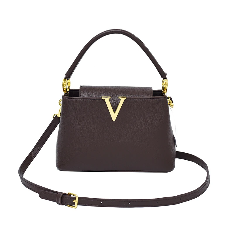 Dark brown structured trapeze bag with top handle and long strap