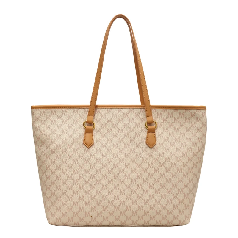 Cream and tan all-over pattern tote with slim handles