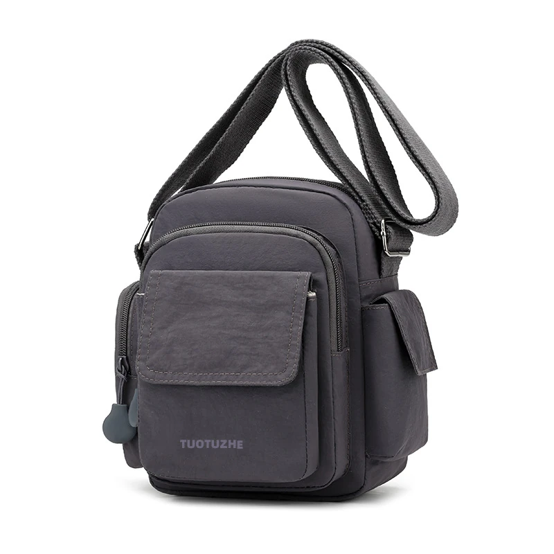 Charcoal vertical utility bag with front flap and wide shoulder strap