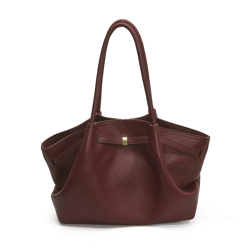 Burgundy shoulder tote with wing-like side folds and long handles